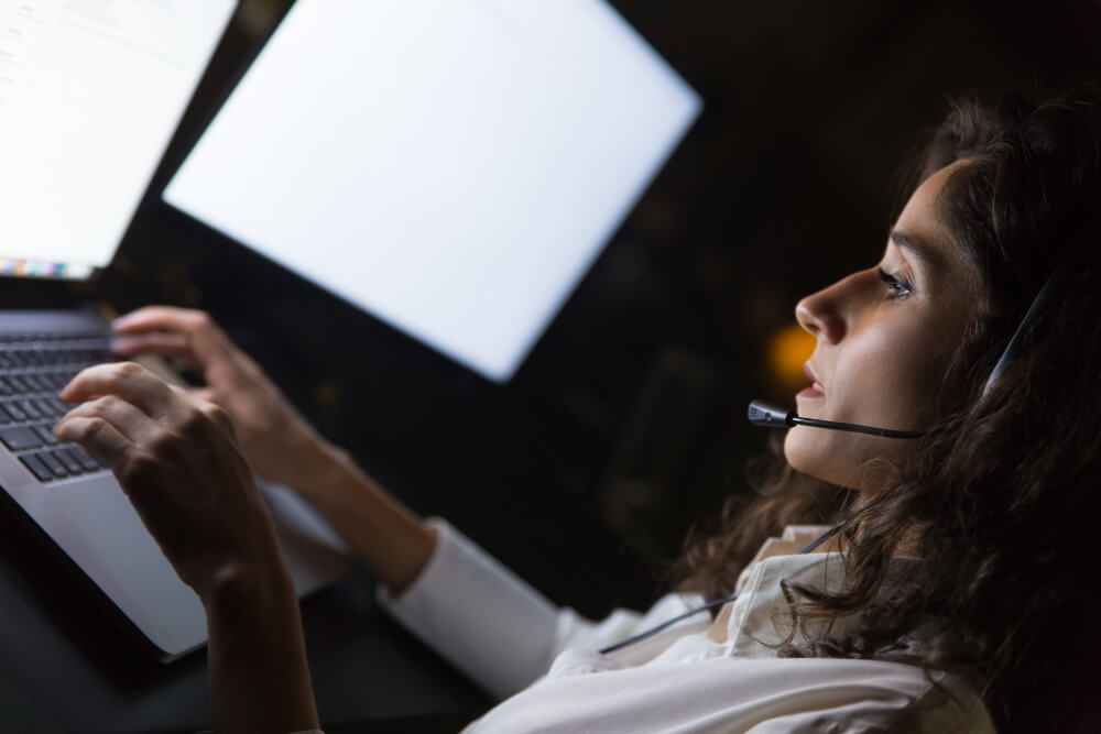 Woman working remotely with chat support