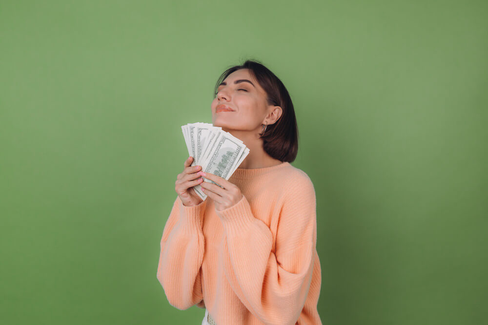 Woman with free money in cash